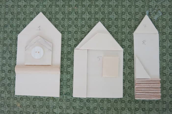 Adding pieces of scrap wood creates some architectural detail to each building on my sign.