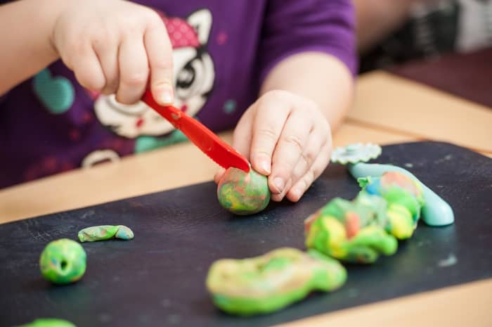 Getting your child involved in making homemade cooked playdough is a great experience for parent and child alike!