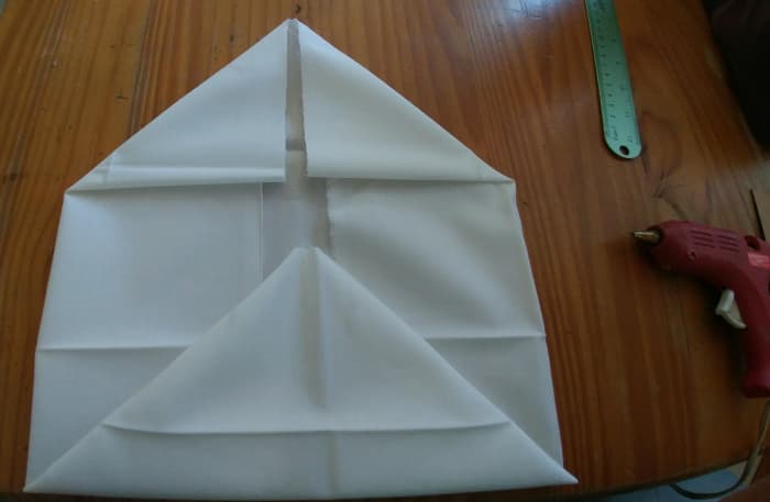 Glue the top folds closed, and the bottom right and left corners of folds.