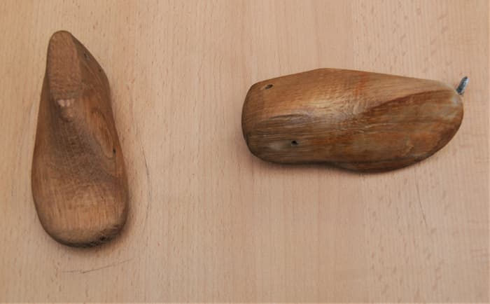 The shoe lasts are screwed to a piece of board, making this project easier to manage.