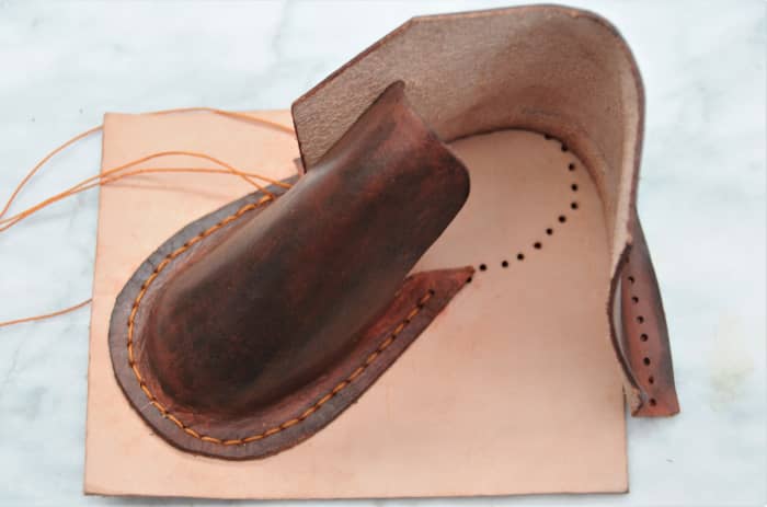 Join the front to the back and then sew this onto the upper sole. As can be seen here, the upper sole was not cut until the sewing was completed.