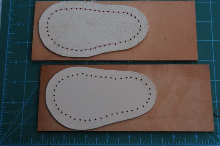 Cut the leather and punch holes around the previously traced lines around the shoe last.
