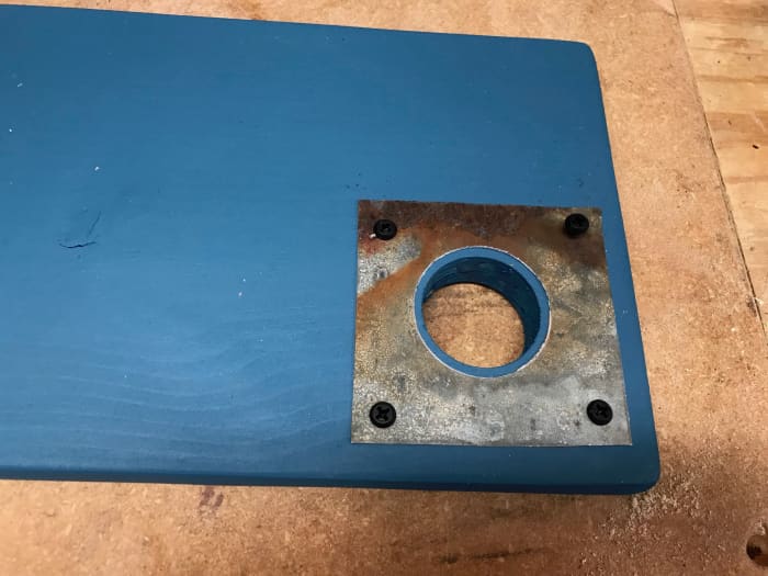 After drilling the entrance hole, fitting the front to the box, sanding, painting and adding the metal guard, the door is ready.