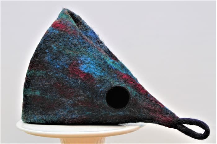 A side view of the pod. Make a fold in the side of the pod as shown, shape and leave to dry.