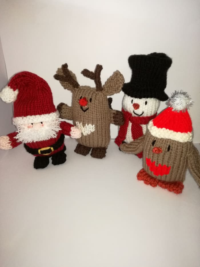 Photo 19. Here is my Christmas knitted doll family—all of these patterns/tutorials are on FeltMagnet.