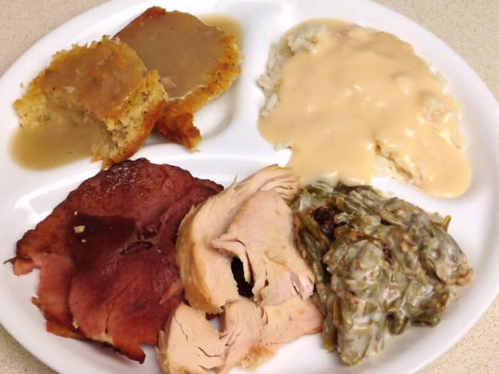 Thanksgiving leftovers: maple glazed ham, roasted turkey, green bean casserole, rice with ham milk gravy, and cornbread dressing with giblet gravy