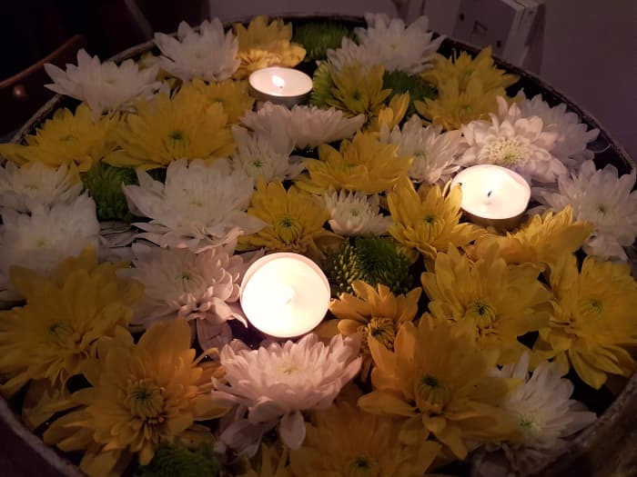 Candles and flowers are the two most popular offerings used by Halloween revelers to honor the dead in the Philippines.