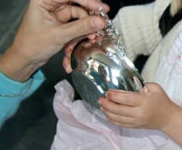 The bottom side of a porringer is a perfect place to engrave a message to the child getting baptised. The message should include the date of the Christening.