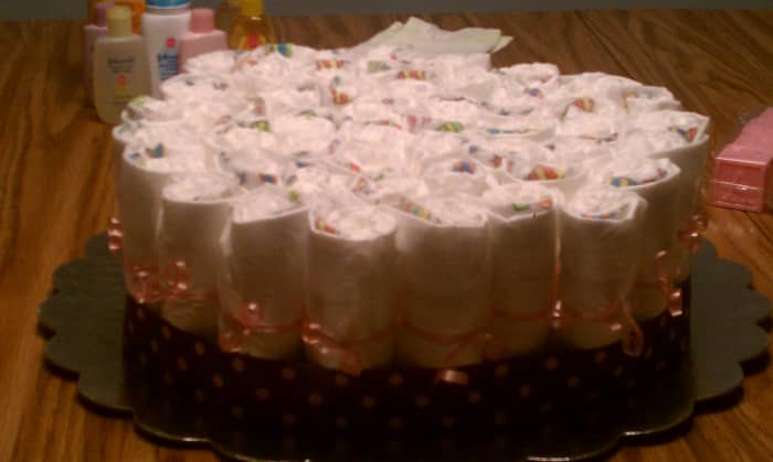 Now that you've finished the base of your diaper cake, you'll want to follow suit with the next two layers.