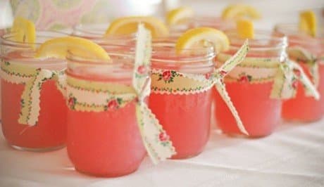 You could use the jars as drinking glasses and then let each guest take them home at the end of the night.