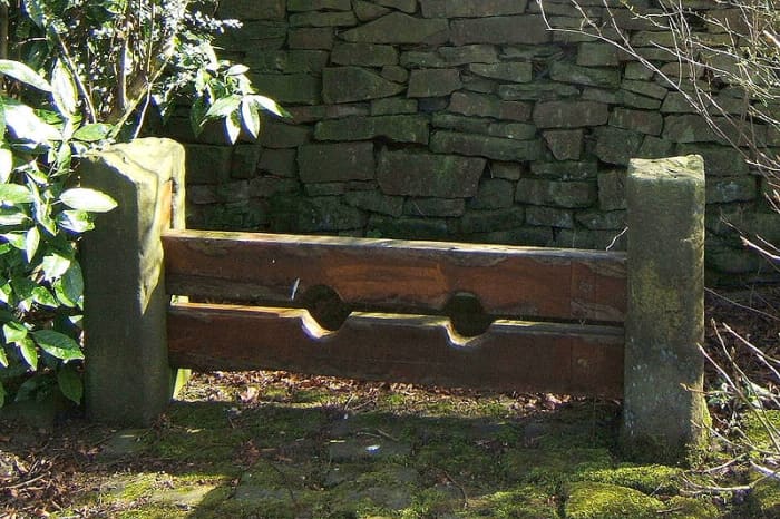Old Stocks at Chapeltown, Lancashire, UK. The prisoner was required to kneel or lie down, face up or face down, in these stocks.