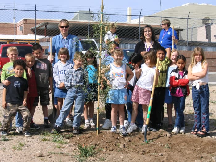 My daughter's second grade class, 2005, after planting one of the trees they bought with the funds from their "Kiss the Pig" penny drive.