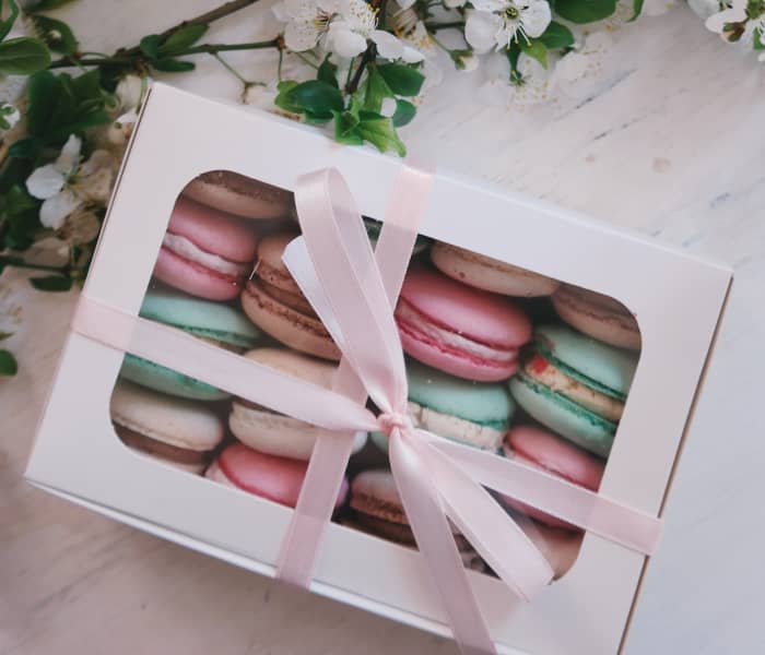 Macarons, chocolates, or other nicely packaged food items make for a nice Christmas gift that won't go to waste.
