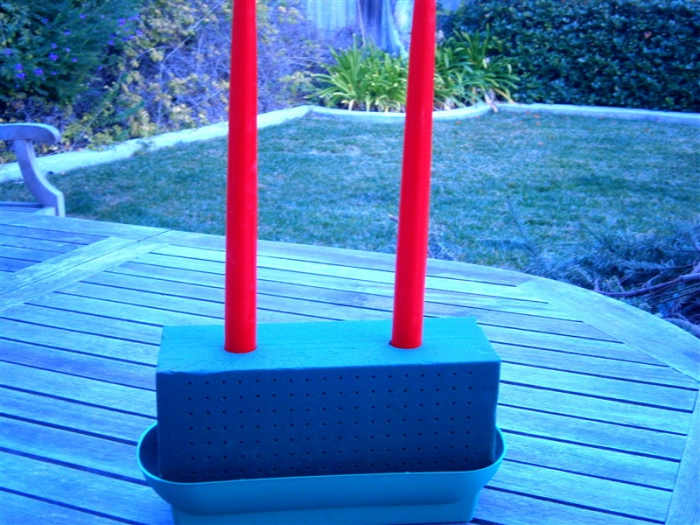 Pop soaked floral foam into container and place candles at desired places. The container is 70 cents.