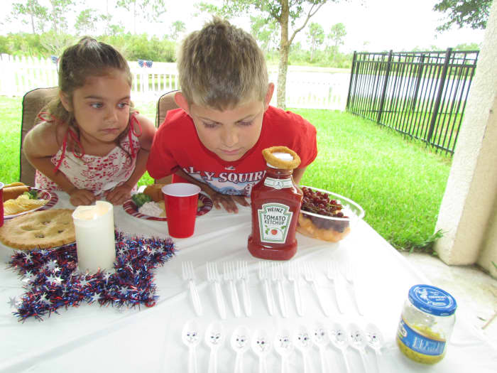 The Revolutionary War is about to begin. (See how serious my kids are . . . they are really getting into the story.) King Ketchup of England is fighting against George Washington, as Relish.