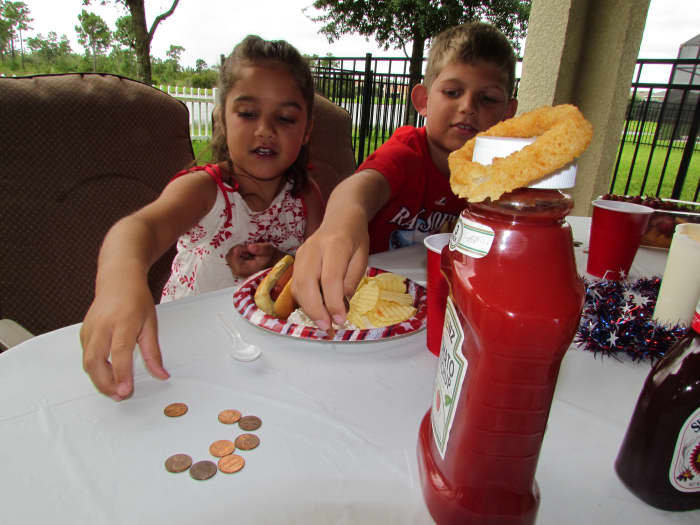 Unrealistic demands: The children are giving the King of Great Britain, seen here as Ketchup with a crown of an Onion Ring, their taxes.