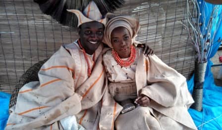 The bride and groom in their traditional attire. The attire depicted here in this traditional wedding picture is the Yoruba Attire.