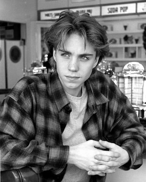 Jonathan Brandis Dec.1993 in Los Angeles, shopping on Ventura Blvd. Flannel shirt, t-shirt, and curtained hair.