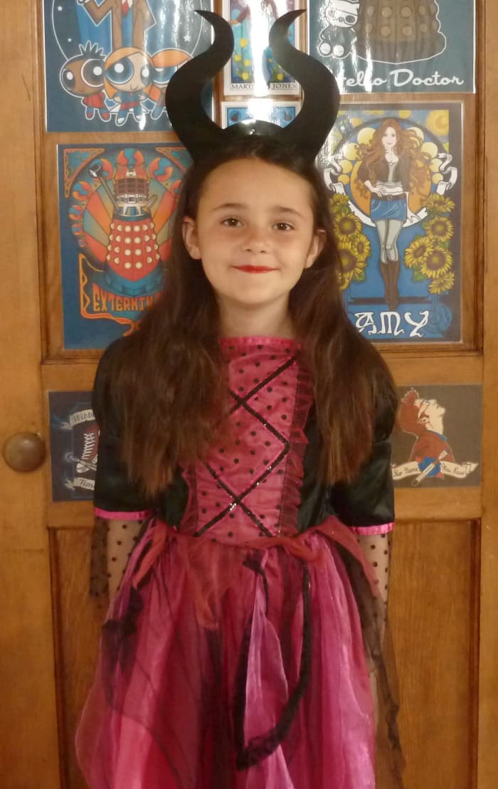 My little girl loves her DIY Maleficent evil witch headband for dressing up with and it's easy for her to pop off and on in her hair.
