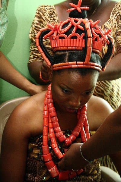 Traditional coral beads on a bride.
