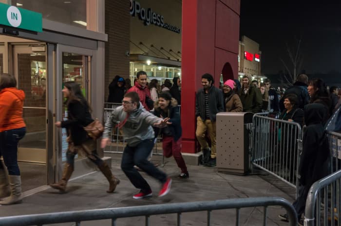 Frantic shoppers rush into their favorite stores to get the best deals of the season.