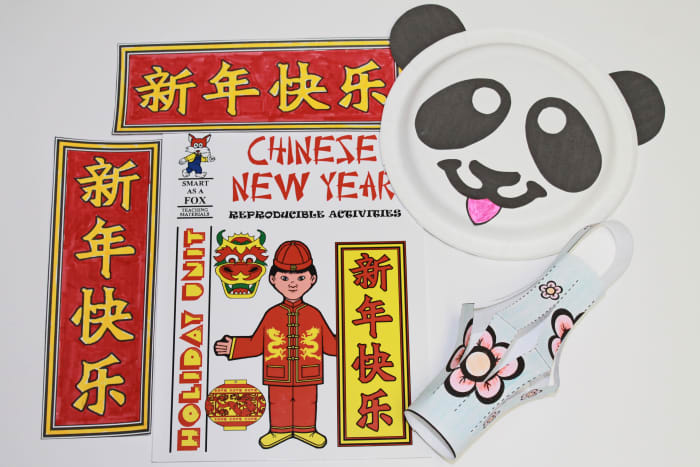 Here you see several of the crafts from inside the book assembled: paper plate panda, paper lantern, and lucky banners. See below for summary of book.