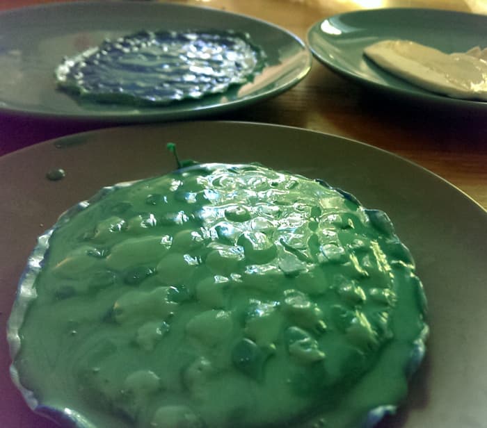 This is what my molds looked like after 3 layers of latex. In this picture the third layer is drying. You can see that when I made the mold I left a little room around the scale pattern, making for peel off without stretching the scales out.