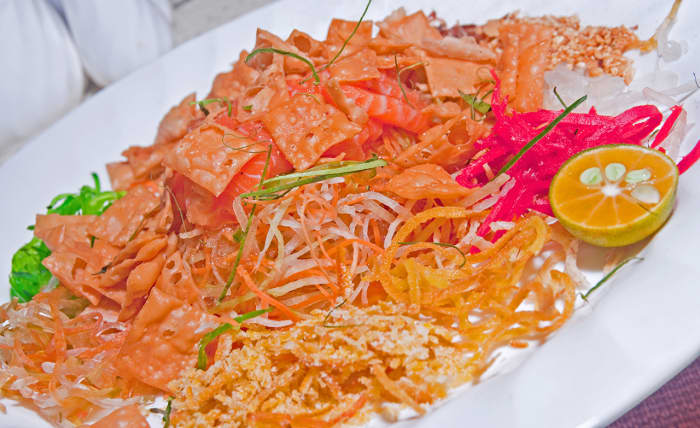 Yusheng is a classic raw fish dish eaten on the Seventh Day in Southeast Asia. There is, naturally, a Chinese New Year legend associated with this practice.