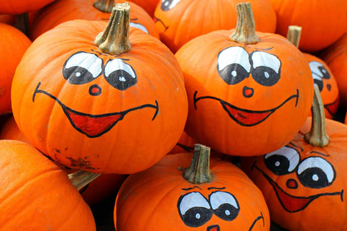 A safer alternative to lighting pumpkin with a candle is to use a battery-powered tea light or a solar-powered LED light. You could also paint faces on your pumpkins instead of carving them up with sharp tools.