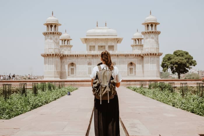 A good backpack will be one of the most appreciated gifts for a woman who likes to travel to places that require lots of walking or climbing like Lands End England in this photo.