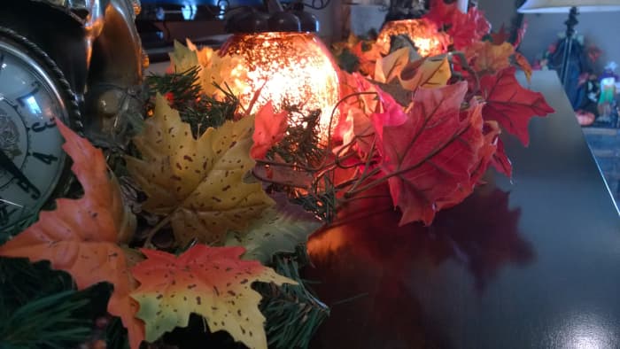 This brightly colored fall garland and light glob easily blends with Christmas decor later on.