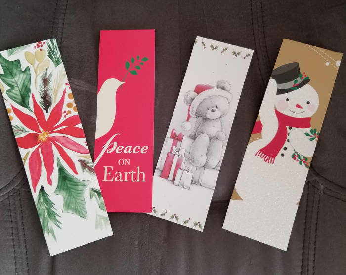 I suggested this to my public library and they received bags and bags of cards from library users. Volunteers turned them into bookmarks. These were stacked by the checkout desk for people to take.