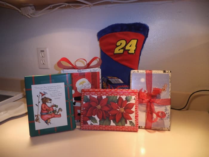 When I'm mailing gifts, I usually skip the bows which get crushed in the mail. Instead, I decorate the package with colorful cards and tie with a ribbon or yarn.