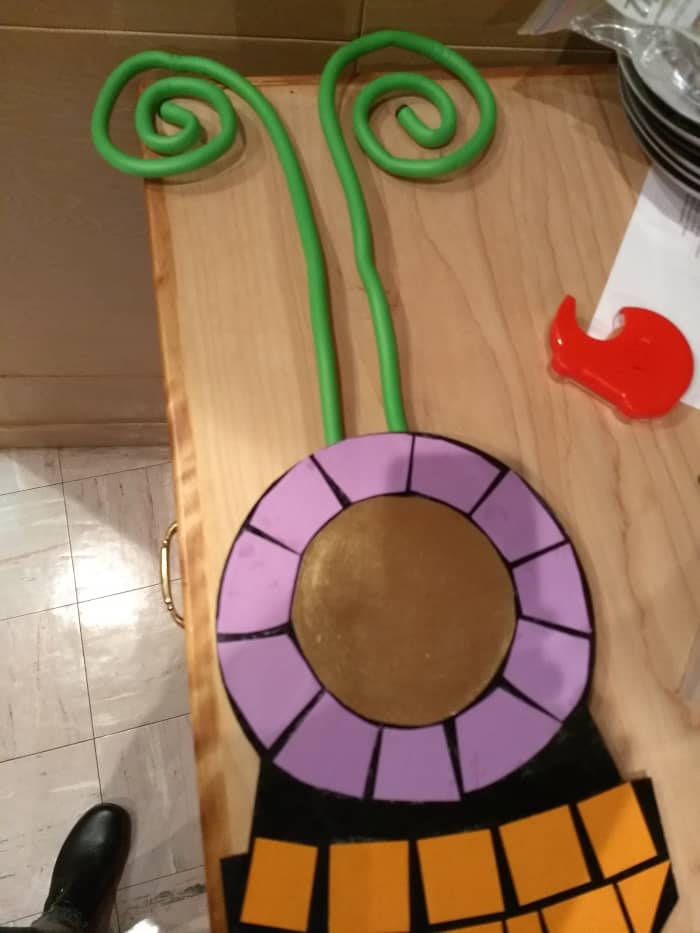 We found some electric cord ties in a lime green that worked perfectly for the butterfly's antennae—a fun, whimsical touch.