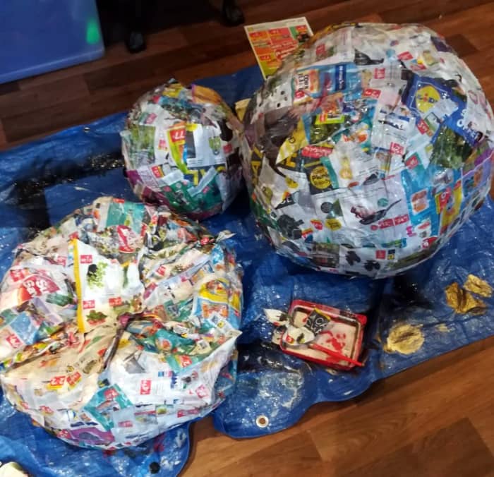 I use my homemade glue mixture to coat the inflated beachballs with newspaper. This process is very similar to paper maché.