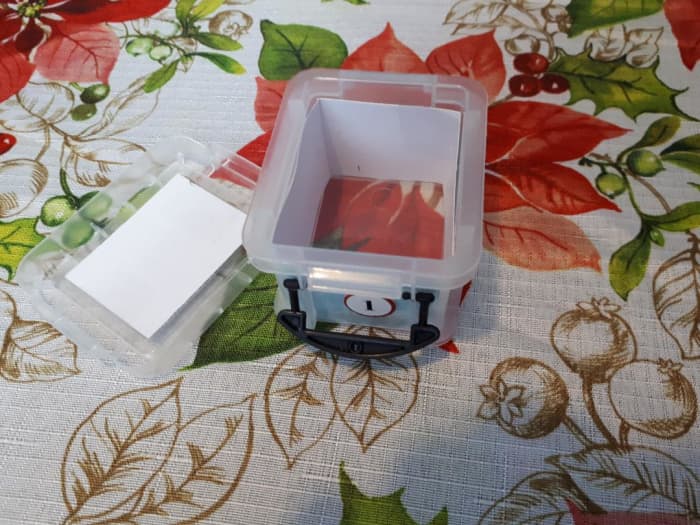 Pictured is box 1 of the advent calendar. Inside of the box, paper is secured with tape so the contents aren't visible from the outside.