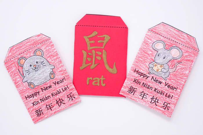 Here are some completed envelopes. You can either print them on white paper and color them, or print them on red paper. Use a gold marker to trace over the character and letters.