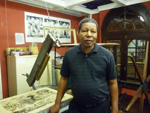 Charles Criner stands by a litho stone in the Printing Museum in Houston, Texas.