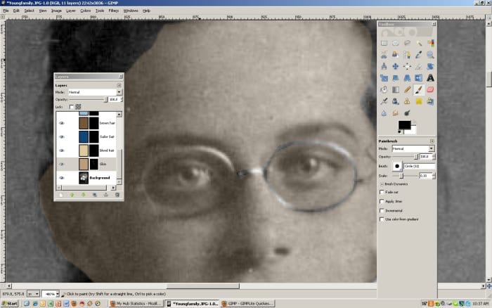 Change the paintbrush to black to erase areas that should not be the chosen layer color. For example, the eyes and glasses will have to be "erased" from the beige color.