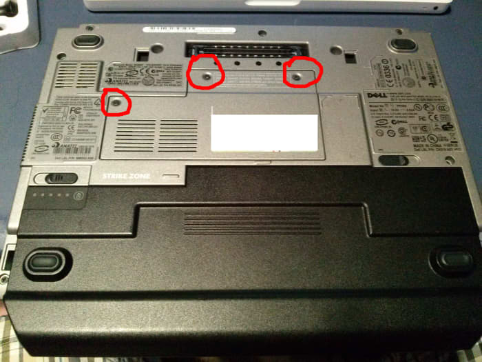 Power off your D430, remove the power cord, flip the notebook over, then remove the battery and loosen the three screws as shown in the red circles, then lift the panel off the bottom of the D430.