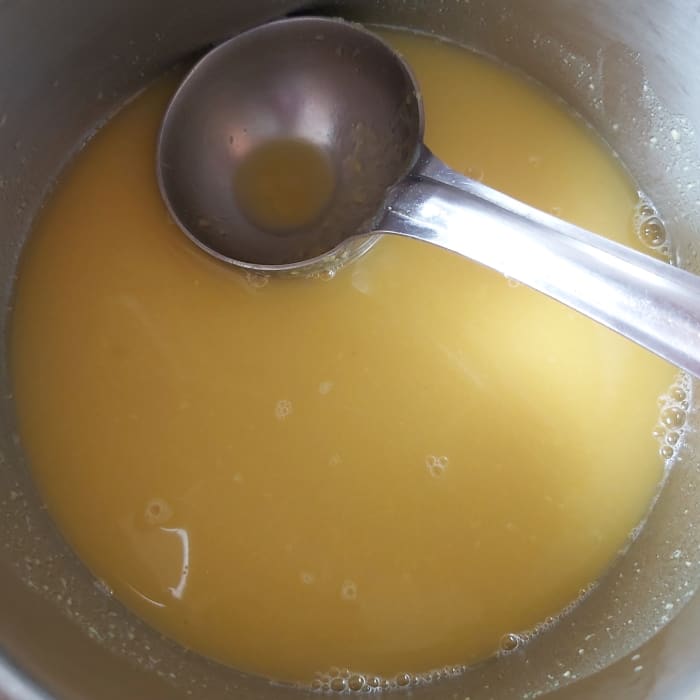 Using a masher or the back of a ladle, mash the cooked lentils to form a smooth paste. Add 1 cup of water.