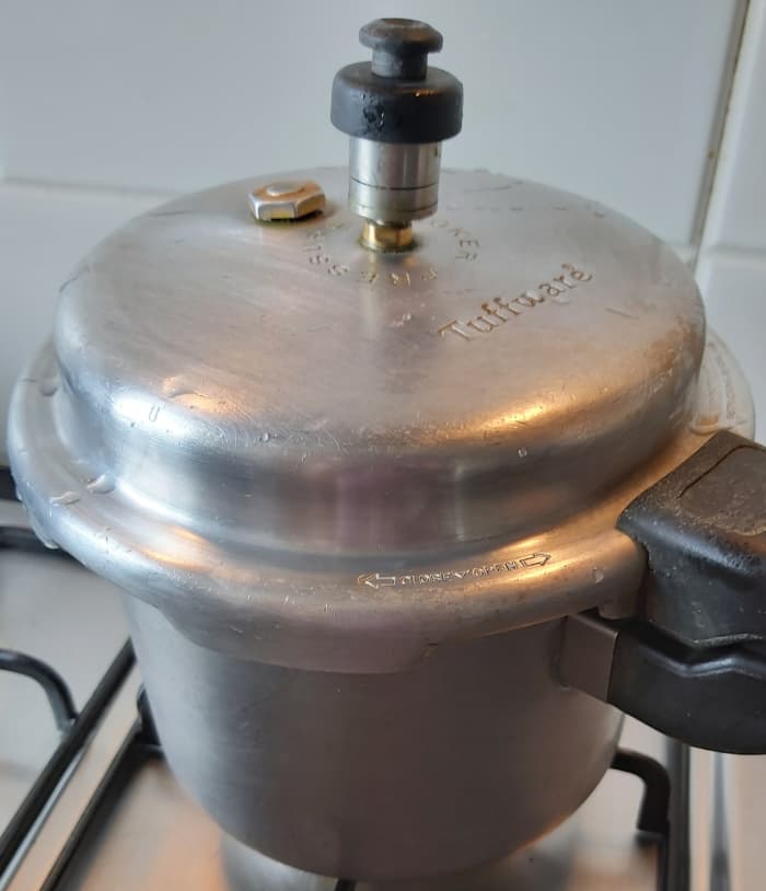 Close the lid and take 4-5 whistles or until lentils are cooked. Switch off the heat and let the pressure release naturally.