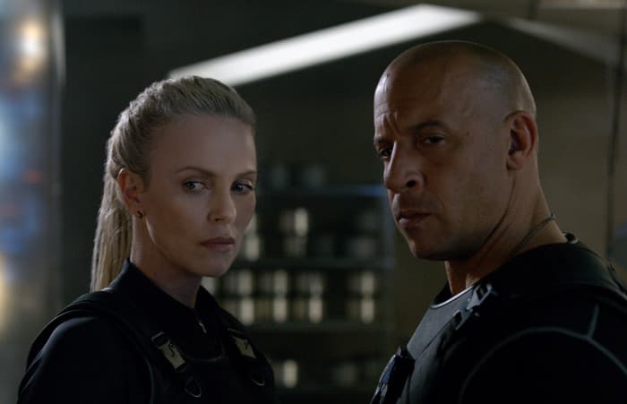 Theron (left) is an intriguing addition to the cast but her motives and ultimate goal remain elusive, undermining her baddie credentials.