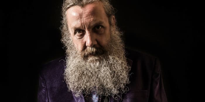Author Alan Moore refuses to be credited for movie adaptations of his work but his influence is everywhere in "Watchmen".