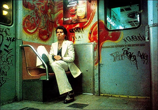The film doesn't shy away from the deprivation of the setting or the fundamental unlikeability of Tony Manero and his friends.