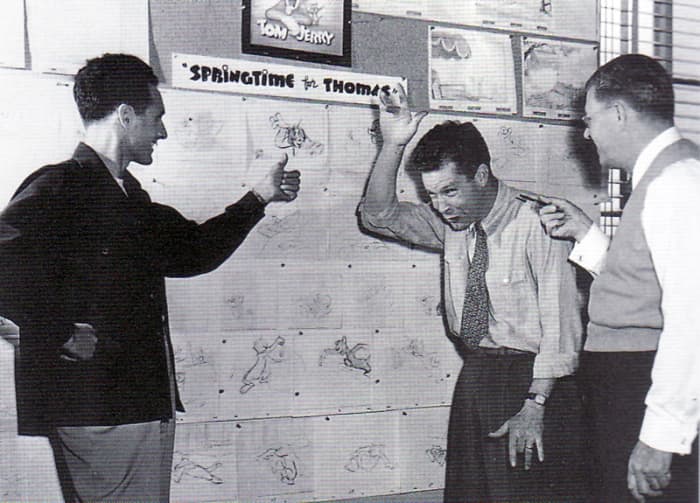 Joseph Barbera (left) and William Hanna (center) going through a Tom & Jerry storyboard with Fred Quimby (right)