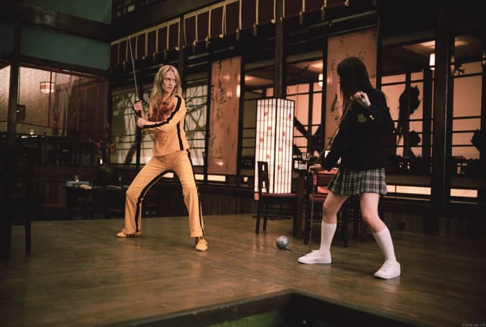 Dressed to kill - Thurman (left) delivers a surprisingly assured confidence in an action role, channelling Bruce Lee through her costume.