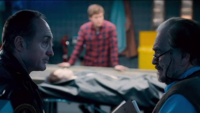 Sheriff Burke and Tommy discuss the discovery of Jane Doe while Austin waits. "The Autopsy of Jane Doe" (2016).