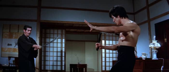 Lee (right) dominates the picture with his magnetic charisma, despite the suspect dubbing. He is undoubtedly the film's star.