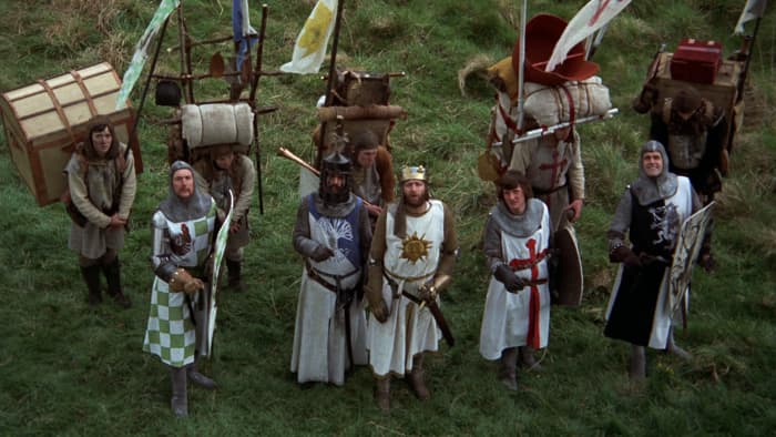 Chapman (centre) leads the Python boys on a magnificent medieval quest to find the Holy Grail... possibly.